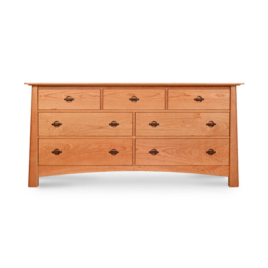 A Cherry Moon 7-Drawer Dresser from Maple Corner Woodworks, handmade from sustainably harvested wood, showcasing a natural finish and black metal handles, isolated on a white background.